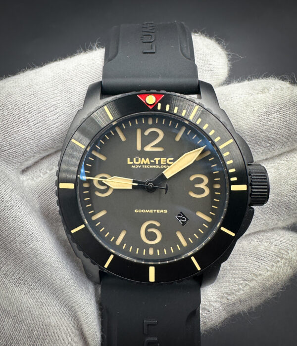 Lum-Tec M90 Automatic in a 44mm stainless steel case, with Titanium Carbide PVD coating, featuring the Sellita SW200-1 automatic movement. This watch is a limited edition 005/300. Includes: outer box (with limited edition number); inner case, warranty card, Lum-Tec Card, Certificate of Authenticity; and brown reverse-hide leather strap.