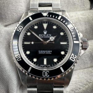 1997 Rolex Submariner 14060 in a 40mm stainless steel case, featuring the Rolex calibre 3000 automatic movement. This Submariner has been tested in excellent working order and is ready for wear or to be added to a collection. Serial Number: U727XXX