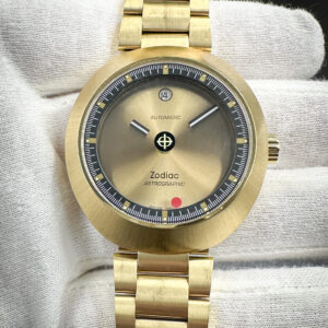 Zodiac 50th Anniversary Astrographic Z06607 Limited Edition 96/182 in a 40mm gold-plated stainless steel case, featuring the STP3-13 (ETA 2824) automatic movement. This Zodiac includes: outer box, inner case, booklet, textile patch, and two extra links.