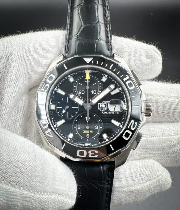 Tag Heuer Aquaracer Chronograph CAY211A-0 in a 43mm stainless steel case, featuring the Tag Heuer Caliber 16 automatic movement. This Tag Heuer includes a new, unworn Tag Heuer black leather strap.