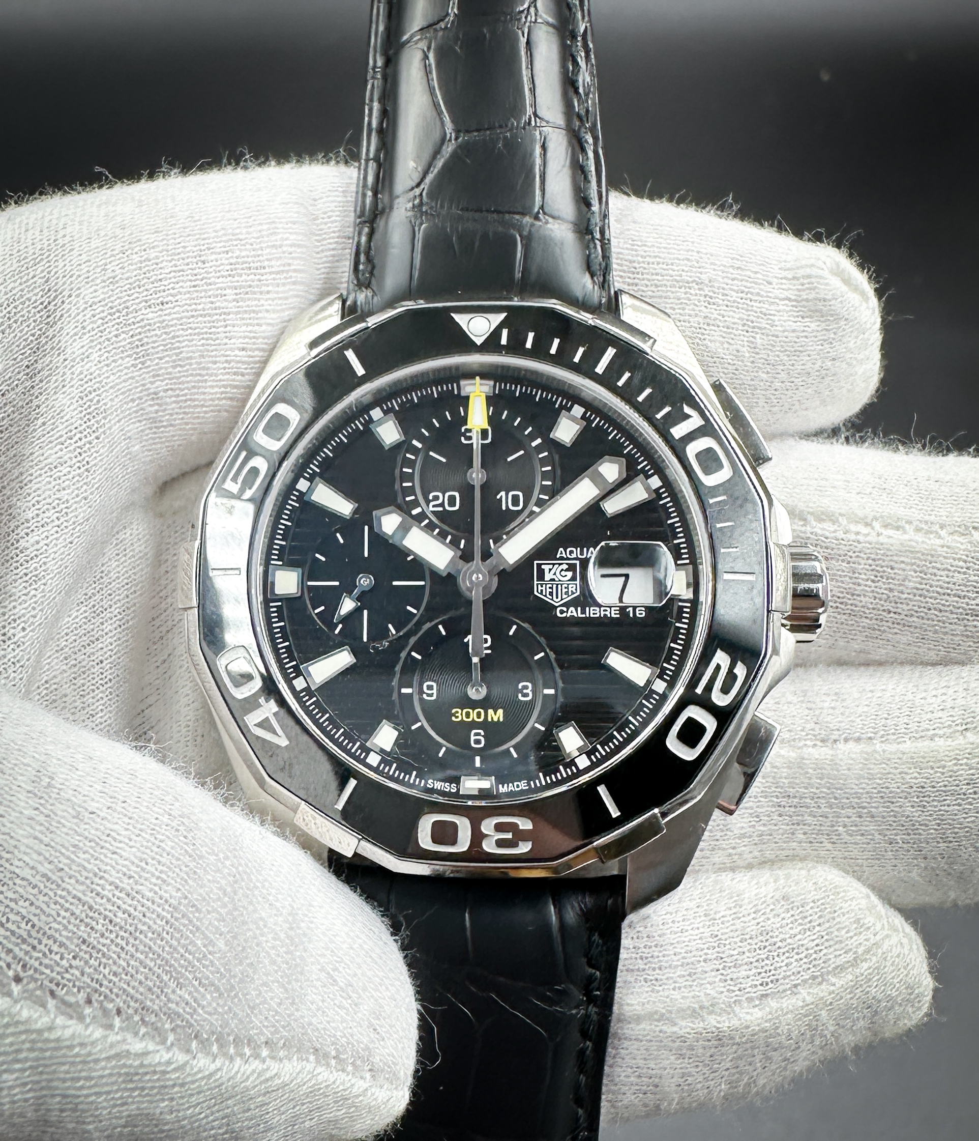 Tag Heuer Aquaracer Chronograph CAY211A-0 in a 43mm stainless steel case, featuring the Tag Heuer Caliber 16 automatic movement. This Tag Heuer includes a new, unworn Tag Heuer black leather strap.