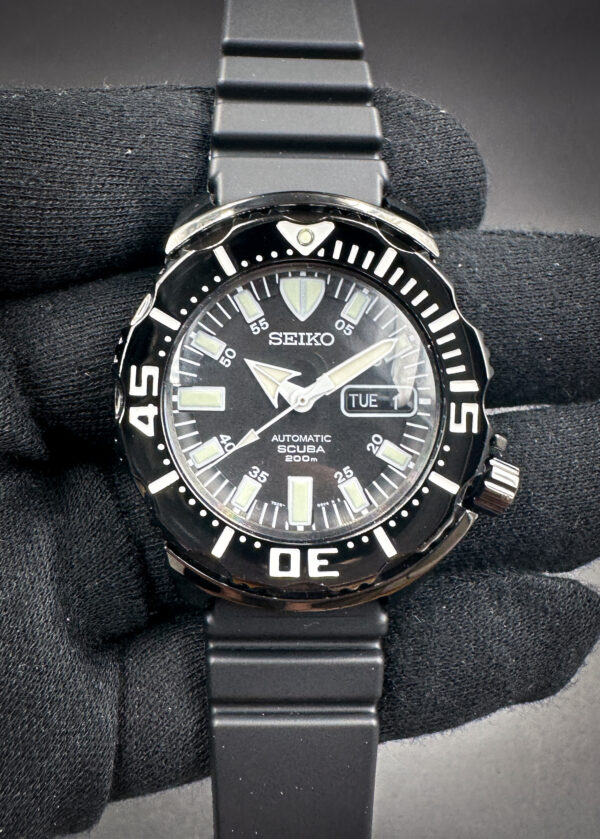 Seiko 7S26-03G0 SZEN002 Black Night Monster in a 42mm black stainless steel case, featuring the Seiko 72S6 automatic movement. This Seiko has been tested in excellent working order and is ready for wear or to be added to a collection. Includes a new black watch roll from Wrist Wraith and a TLC warranty card.