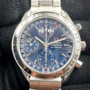 1998 Omega Speedmaster Day-Date Triple Calendar 3523.80 in a 39mm stainless steel case, featuring the Omega caliber 1151 automatic movement. This Speedmaster has been tested in excellent working order and is ready for wear or to be added to a collection. It includes the outer box; inner wooden case; travel box; operating instructions, leather wallet; and a TLC warranty card.