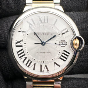 Cartier Ballon Bleu W2BB0031 in a 42mm stainless steel and yellow gold case. This Cartier includes the original box, booklets, warranty card, receipt, and one (1) additional link. Serial Number: 3765279XXXX