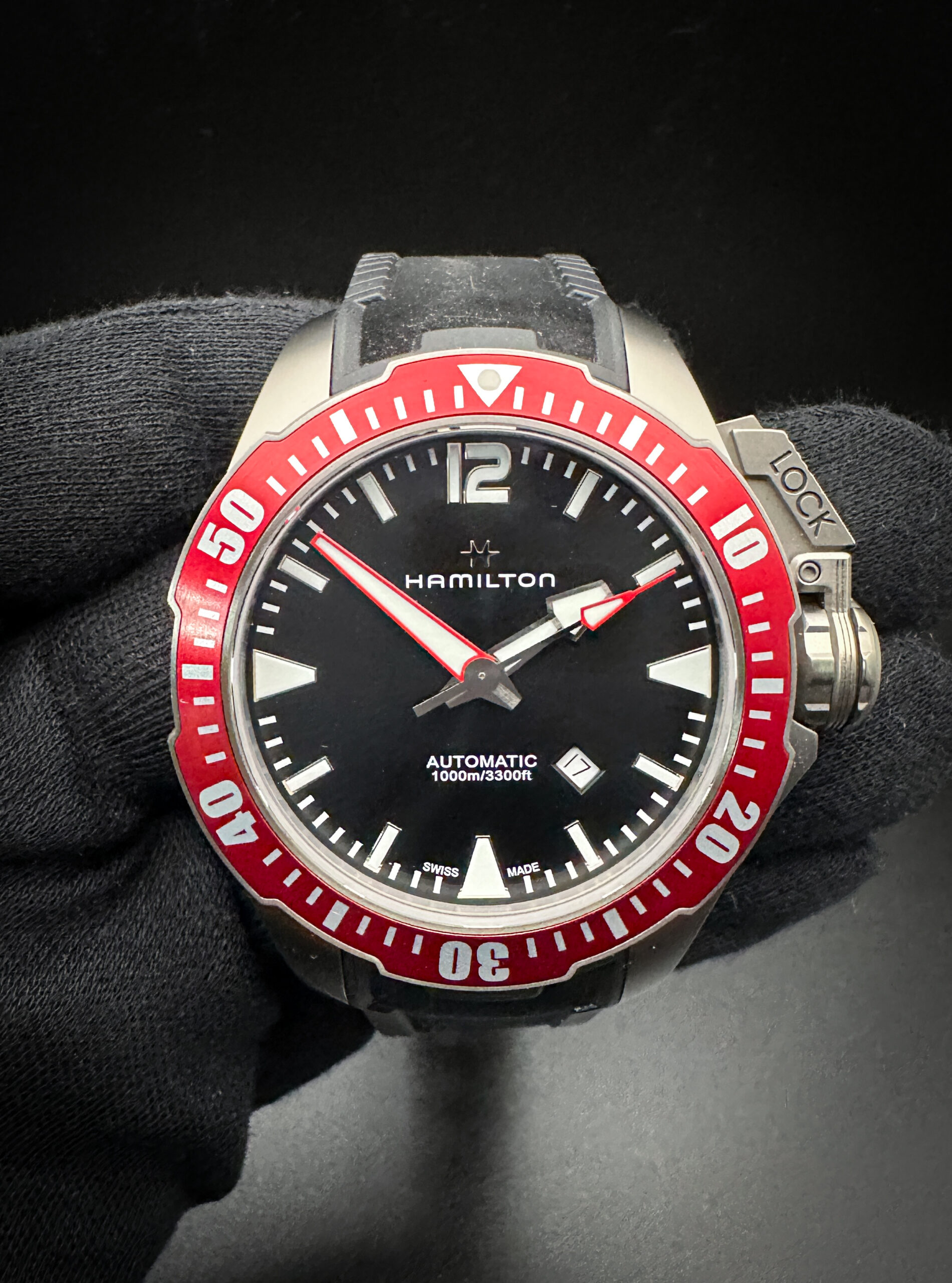 Hamilton Khaki Frogman H77865335 in a 46mm Titanium case, featuring the Hamilton H-10 automatic movement. This watch includes the outer box, inner case, booklet, and warranty card. This Hamilton is in excellent condition with no signs of wear or use.