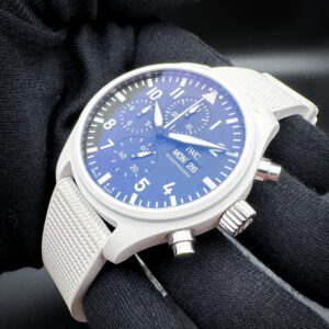 2024 IWC Top Gun "Lake Tahoe" Chronograph IW389105 in a 44.5mm white ceramic case, featuring the IWC Caliber 69380 automatic movement. This IWC is a full set and includes: outer box, inner case, instruction booklet, polishing cloth, warranty card, and extra black two-piece strap.