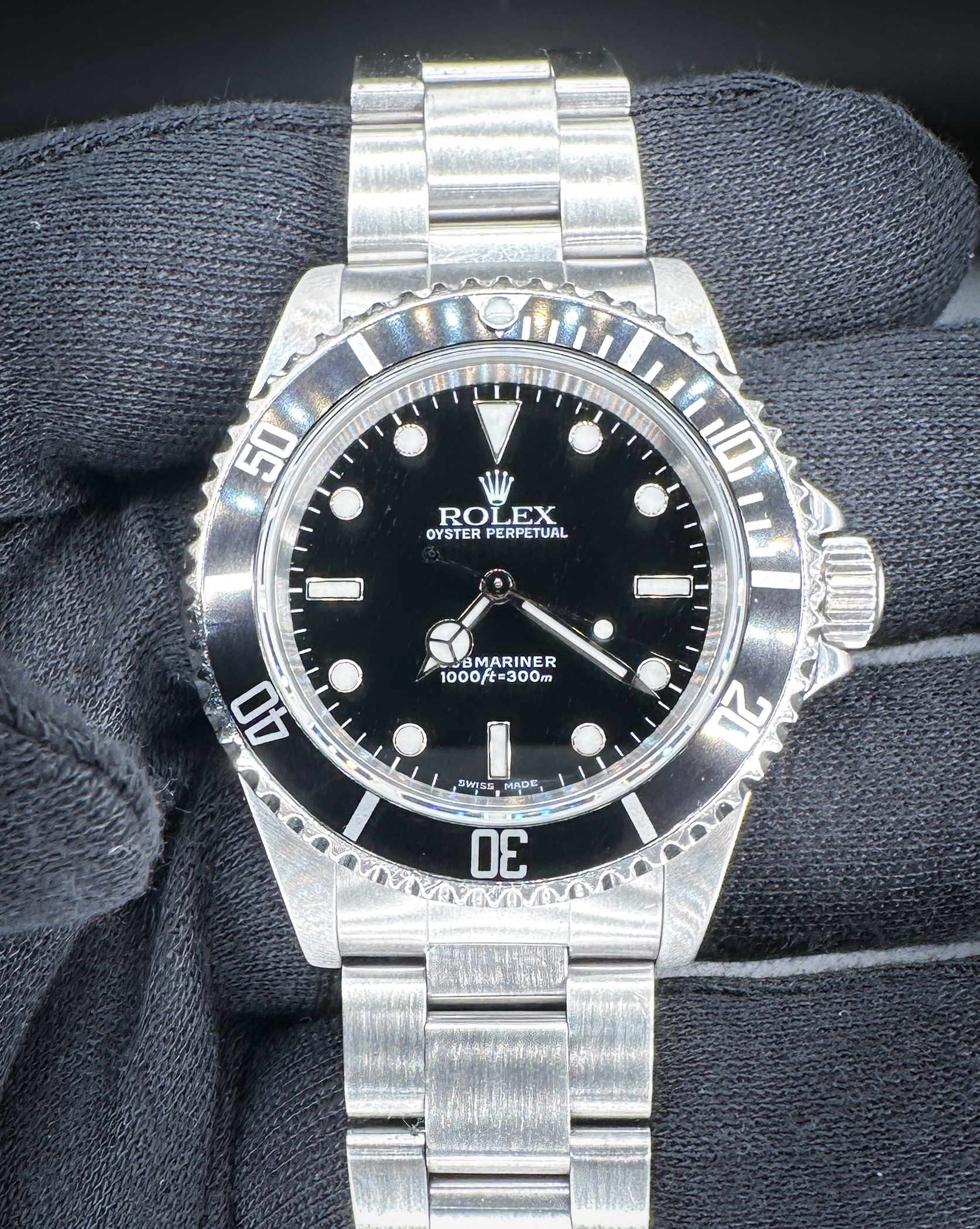 1999 Rolex Submariner 14060 (A-Serial), in a 40mm stainless steel case, featuring the Rolex caliber 3000 automatic movement. This Rolex has been tested in excellent working order and is ready for wear or to be added to a collection. Includes a new Wrist Wraith watch roll and TLC warranty/authentication card.  Serial Number: A934XXX