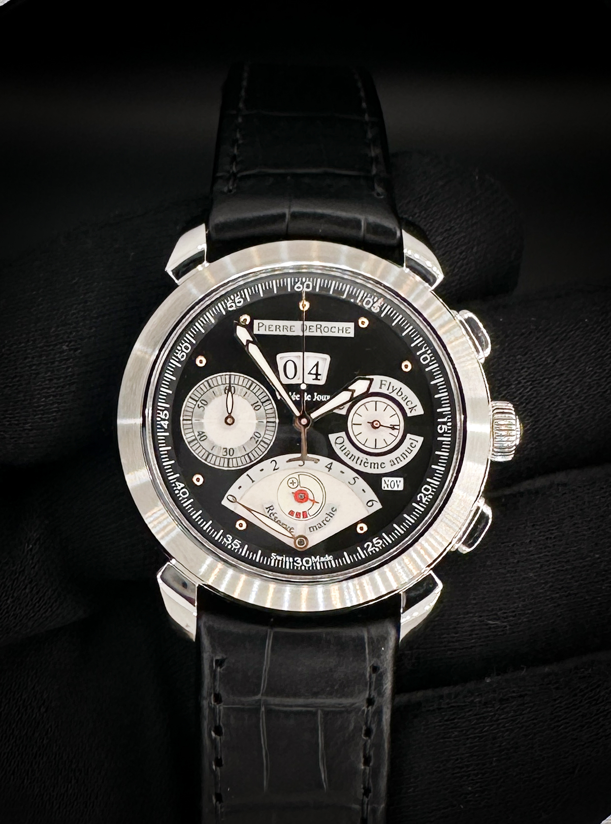 Pierre DeRoche Grandcliff Annual Calendar Flyback Chronograph GRC10001ACIO-SPEC in a 42mm stainless steel case, featuring the PDR-4006 automatic movement. This Grandcliff Calendar is in like-new, unworn condition and includes: outer box, inner case, and operating instructions. 