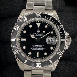 Vintage 1990 Rolex Submariner Date 16610 in a 40mm stainless steel case, featuring the Rolex calibre 3135 automatic movement. This Submariner includes the original box, original bezel, and TLC warranty/authenticity card. Case Serial Number: E578XXX