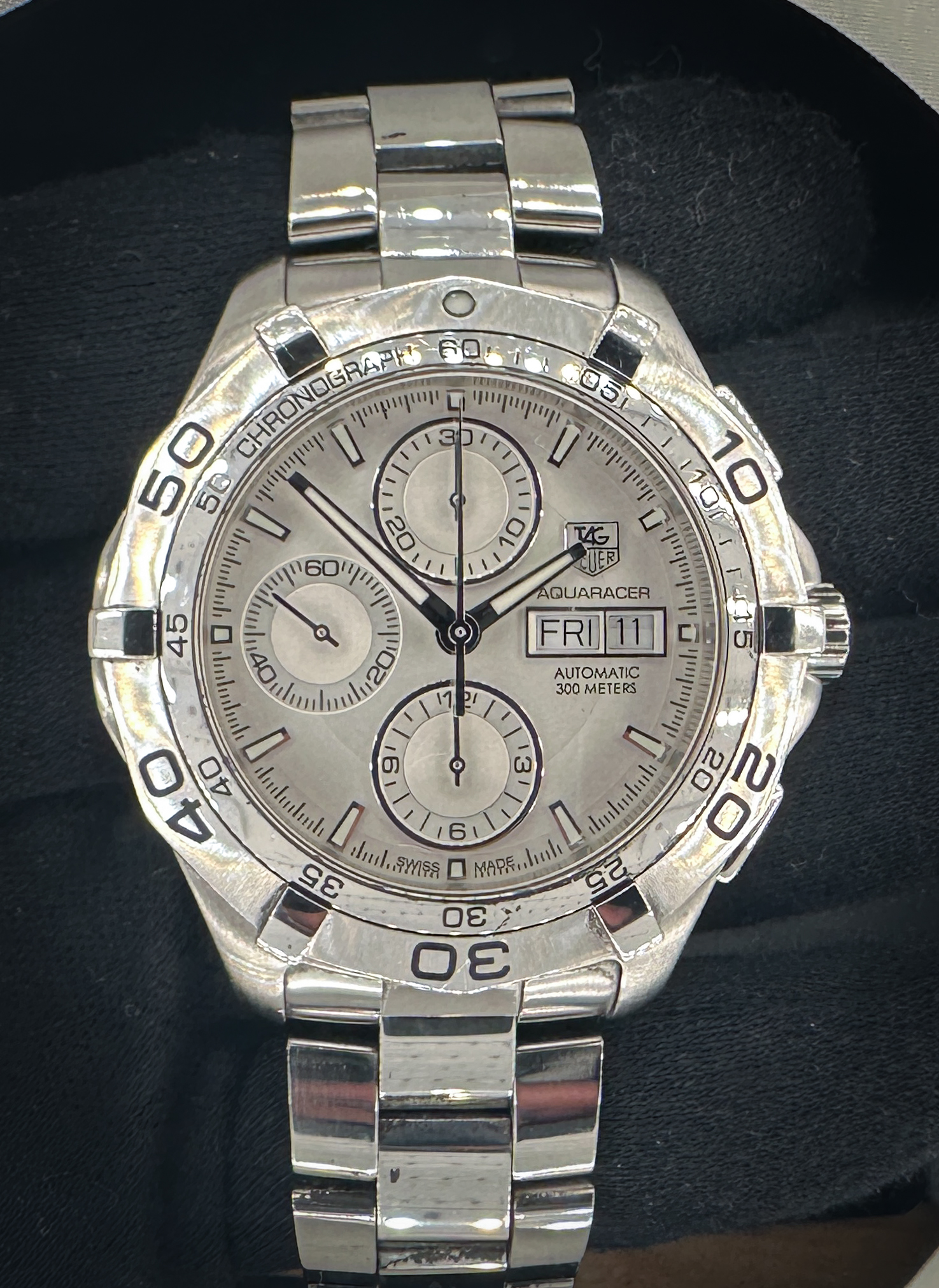 Tag Heuer Aquaracer Chronograph CAF2011 in a 43mm stainless steel case, powered by the Tag Heuer caliber 16 automatic movement. This Aquaracer has been tested in excellent working order and is ready for daily wear or to be added to a collection. Includes a new Wrist Wraith watch roll, and TLC Authentication/Warranty card. Case Serial Number: RER5XX