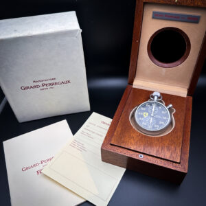 Girard-Perregaux pour Ferrari Sport Timer Limited Edition Stopwatch No. 600, Ref. 89600.0.12.6156. Limited production of less than 1000 pieces in 1990s. Encased in a lightweight titanium case, tempered to give a satin-like yet hard-wearing matte surface finish. The timer comes in its original wooden presentation box, with all documents and even a brown leather lanyard, which snaps on to the crown attachment.