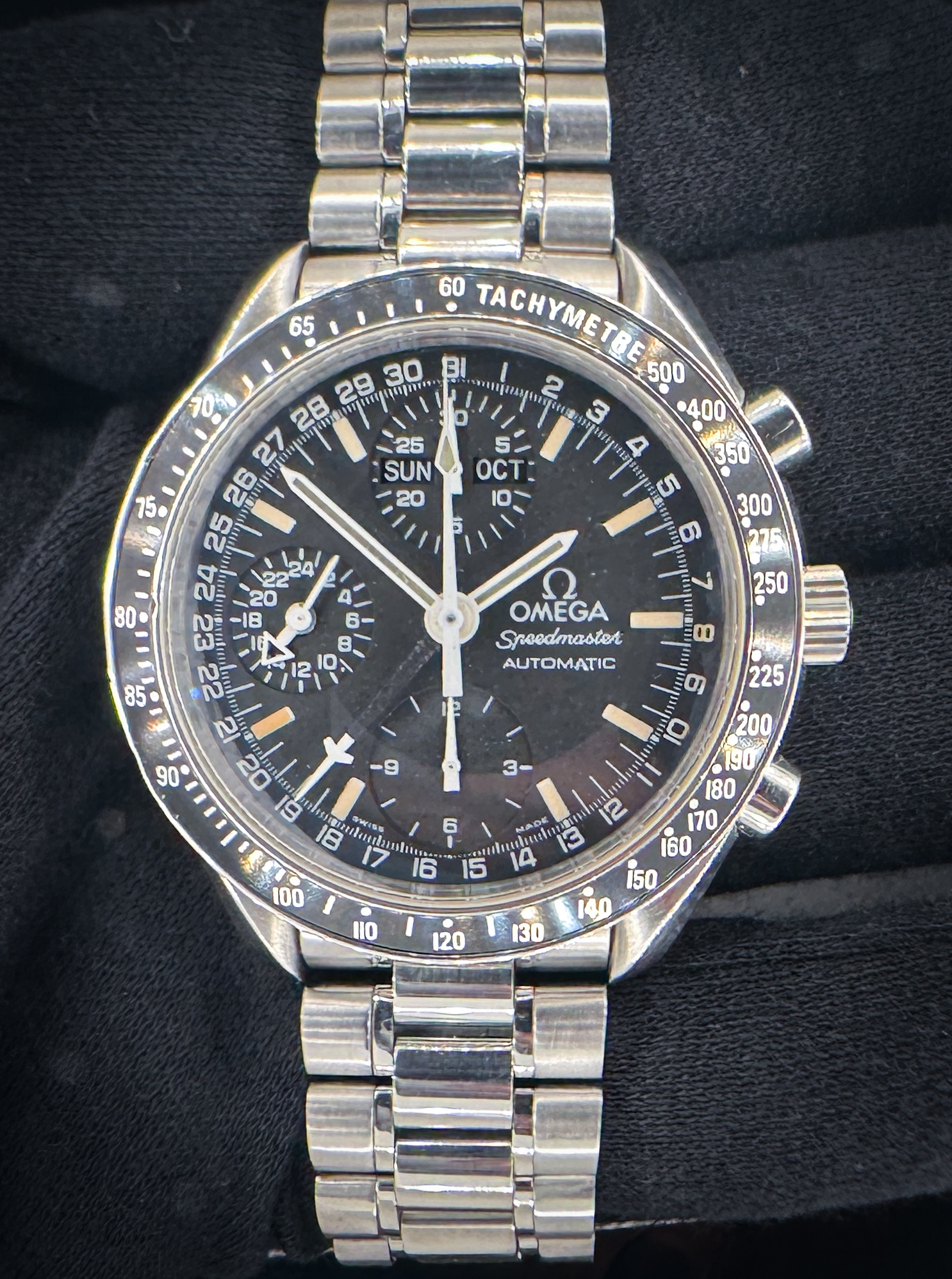 Omega Speedmaster Day-Date Triple Calendar 3520.50 in a 39mm stainless steel case, featuring the Omega caliber 1151 automatic movement. This Speedmaster has been tested in excellent working order and is ready for wear or to be added to a collection. Includes the Omega outer box, inner wooden case, travel case, instruction book, wallet, and TLC warranty card. Caseback Serial Number: 55423XXX