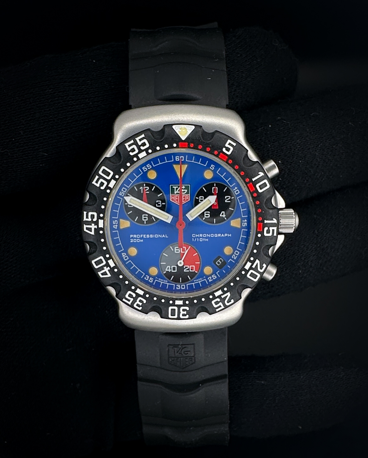 Vintage and Original c. 1997 TAG Heuer Formula 1 Chronograph CA1210-1 in a 38mm stainless steel case, powered by the quartz ETA 251.262. This TAG Heuer has a new battery installed October 2025, and all functions have been tested in excellent working order. Includes the original black rubber strap with the Tag Heuer stainless steel buckle; outer sleeve; outer box; inner case; hang-tag; instructions booklets; warranty booklet; guarantee booklet; and warranty card.  Casebook Serial Number: BK40XX