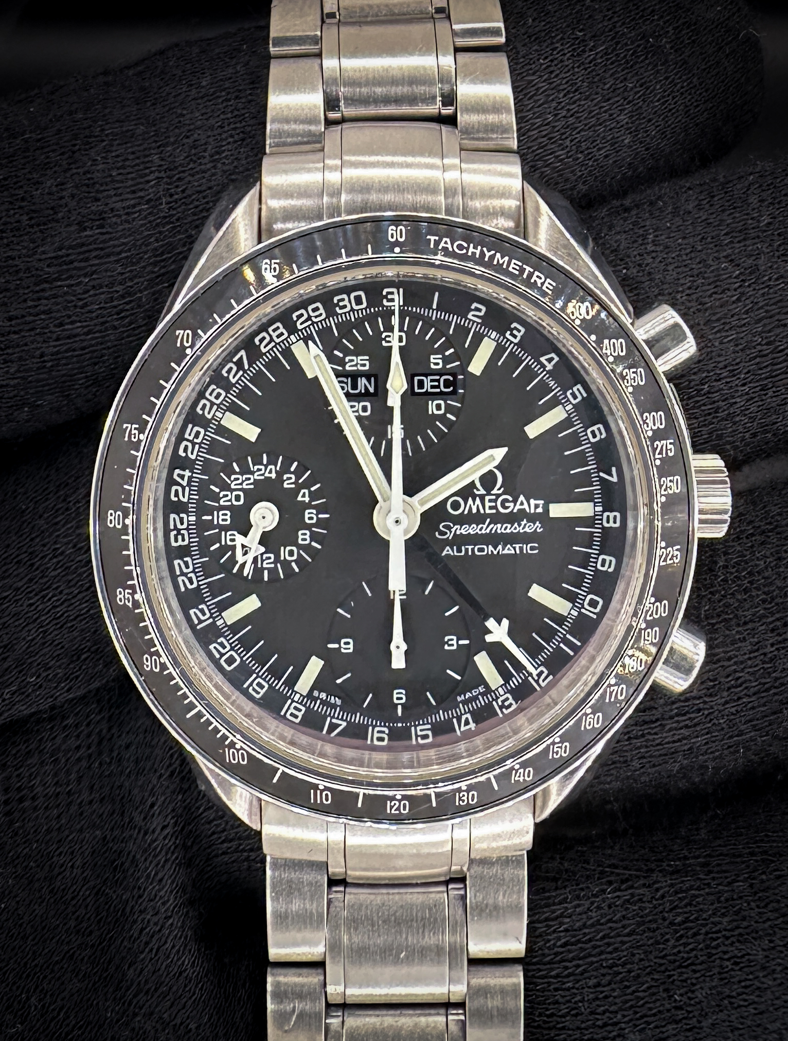 1998 c. Omega Speedmaster Day-Date Triple Calendar 3520.50 in a 39mm stainless steel case, featuring the Omega caliber 1151 automatic movement. This Speedmaster has been tested in excellent working order and is ready for wear or to be added to a collection. Includes the Omega outer box, inner wooden case, travel case, instruction book, wallet, and TLC warranty card. Caseback Serial Number: 55971XXX