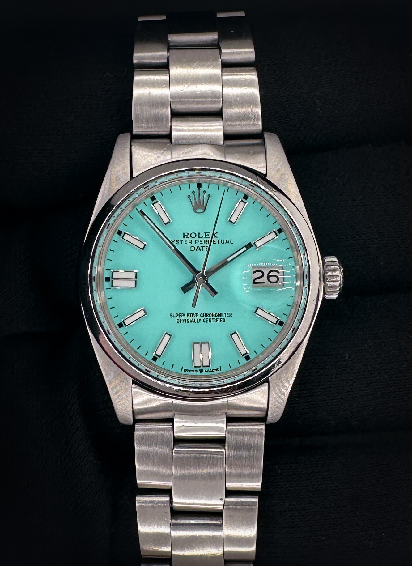 Vintage 1978 Rolex 1500 Oyster Perpetual Date in a 34mm stainless steel case, featuring a custom Tiffany-Blue dial, powered by the Rolex calibre 1570 automatic movement. The caseback interior features four distinct service marks and this Rolex has been tested in good working order. Includes a new Wrist Wraith travel case, as well as the TLC Warranty and Authentication card. Case Serial Number: 5372XXX