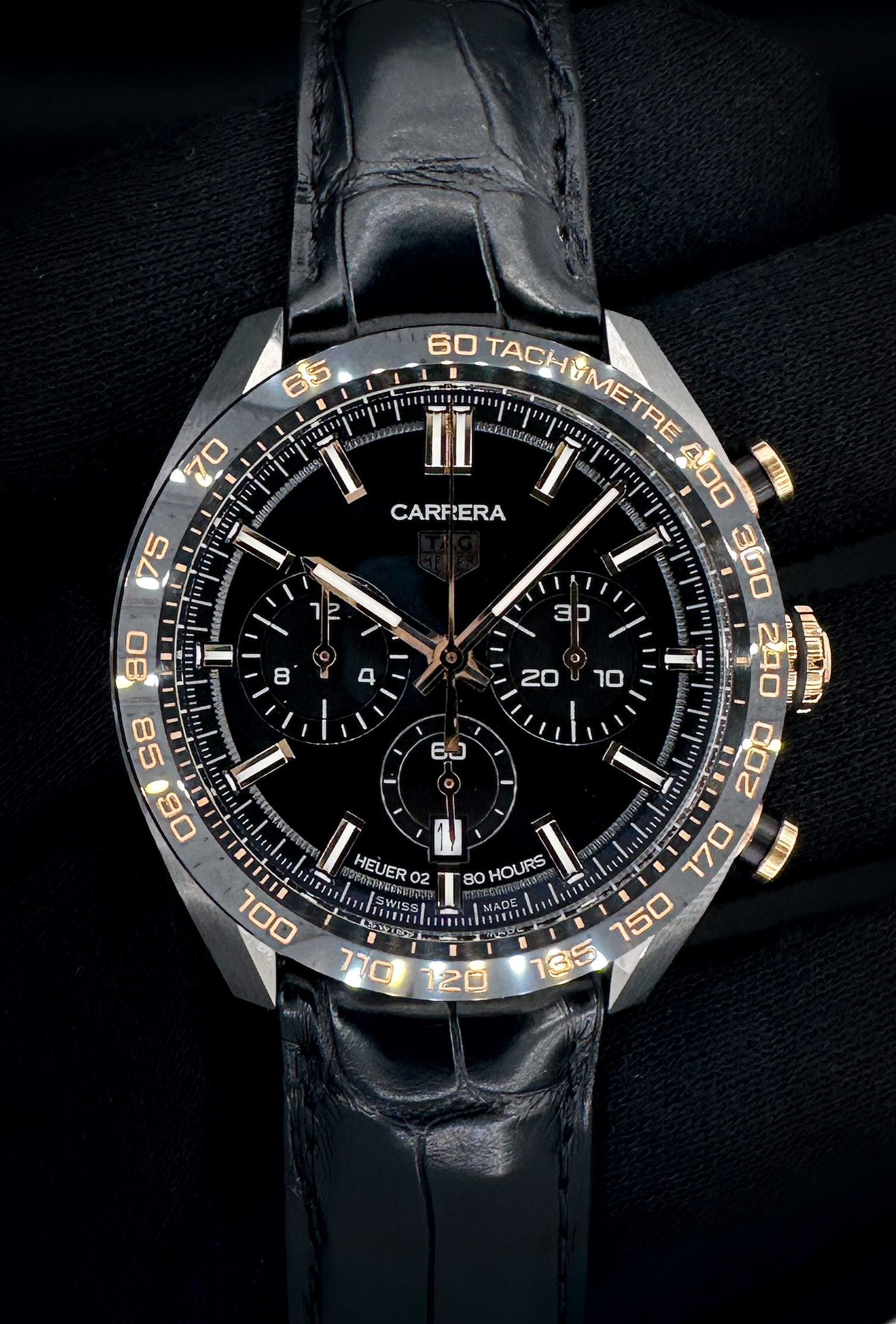 Tag Heuer Carrera Calibre Heuer 2 Chronograph CBN2A5A.FC6481 in a 44mm stainless steel and 18k Rose Gold, featuring a black ceramic bezel. This Tag Heuer is in excellent condition and includes: extra large display case; inner tray; case sleeve; case; thank you display; instruction booklet; and open international warranty.