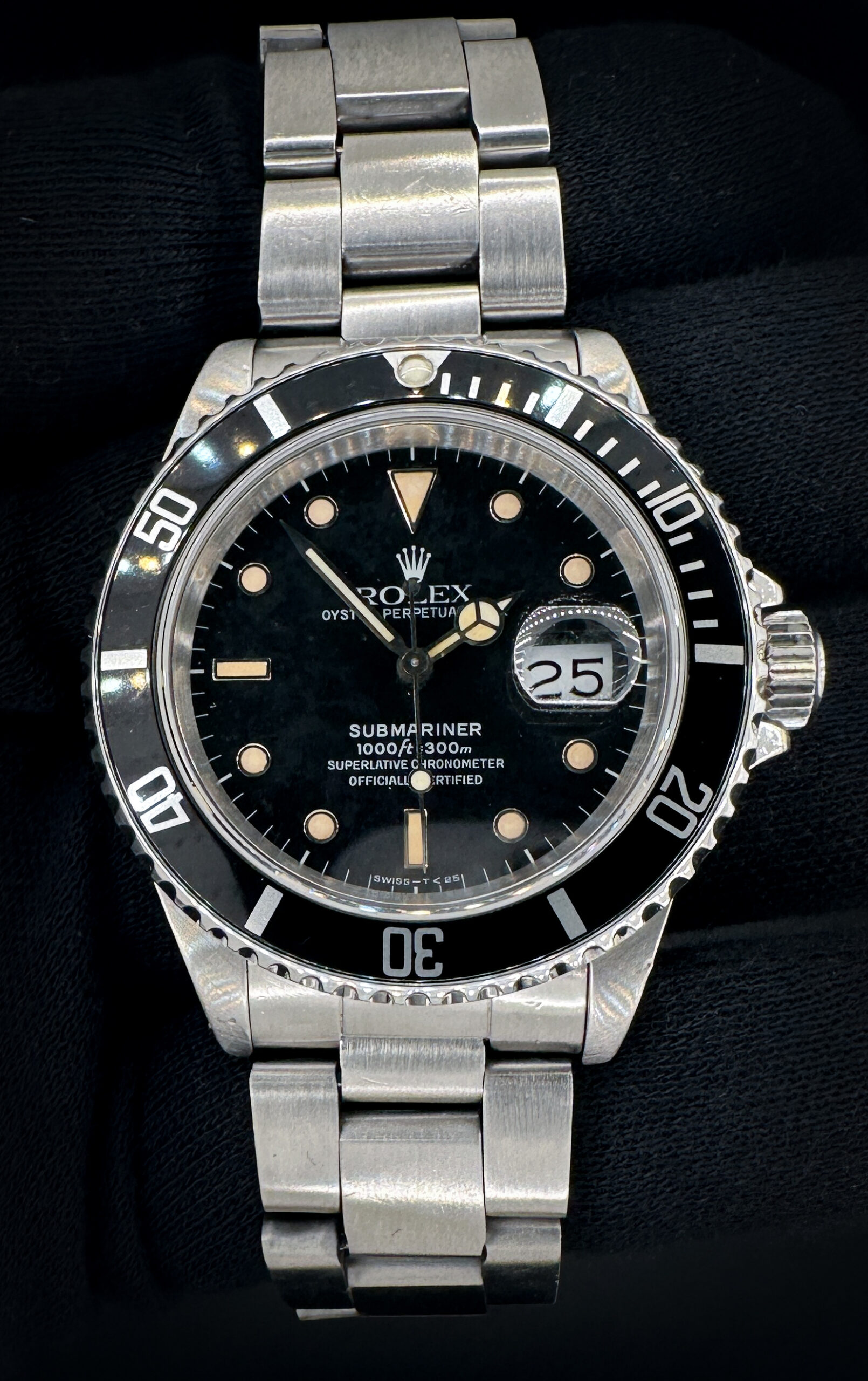 Vintage 1988 Rolex Submariner Date 16610 in a 40mm stainless steel case, powered by the Rolex caliber 3135 automatic movement. This Submariner features an original patina and spidered dial. Includes the original outer box; inner case; anchor chain; hang-tag; leatherette wallet; Oyster booklet; and Submariner Booklet. In-house service completed December 2025. Case Serial Number: R839XXX