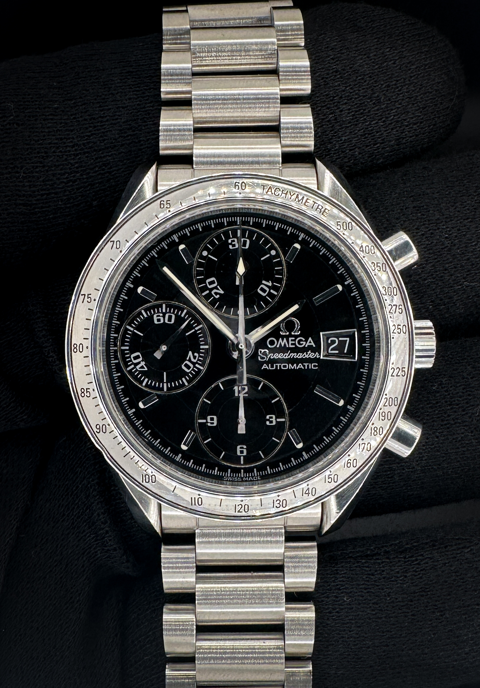 Vintage c. 1998 Omega Speedmaster Date 3513.50.00 in a 39mm stainless steel case, featuring the Omega calibre 1152 automatic movement. This Omega has been tested in excellent working order and is ready for wear or to add to a collection. Includes: outer box; inner case, instruction booklet; leatherette wallet; serial-matching hang-tag; open warranty card; and pictogram card. Please note that the leatherette wallet and case are flaking as common with these vintage accessories. Case Serial Number: 59353XXX