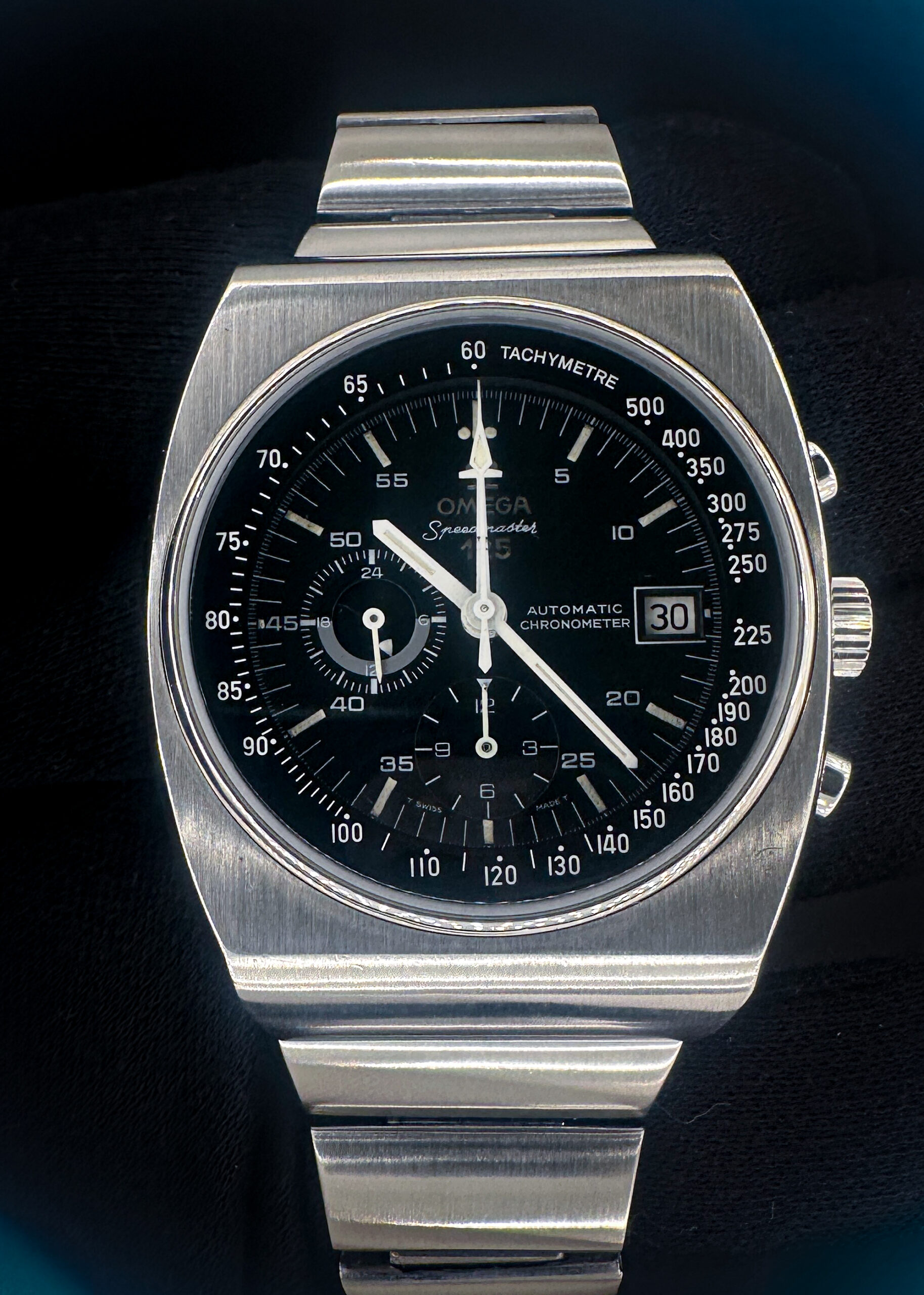 1973 Omega Speedmaster 125th Anniversary 378.0801 / 178.0002 in a 42x51mm stainless steel case, powered by the Omega caliber 1141 automatic chronograph movement. This Omega has been tested in excellent working order (+/- 4SPD / 281 amplitude / .2ms beat error). The interior caseback features three distinct service marks. This Speedmaster includes a red Omega travel box.