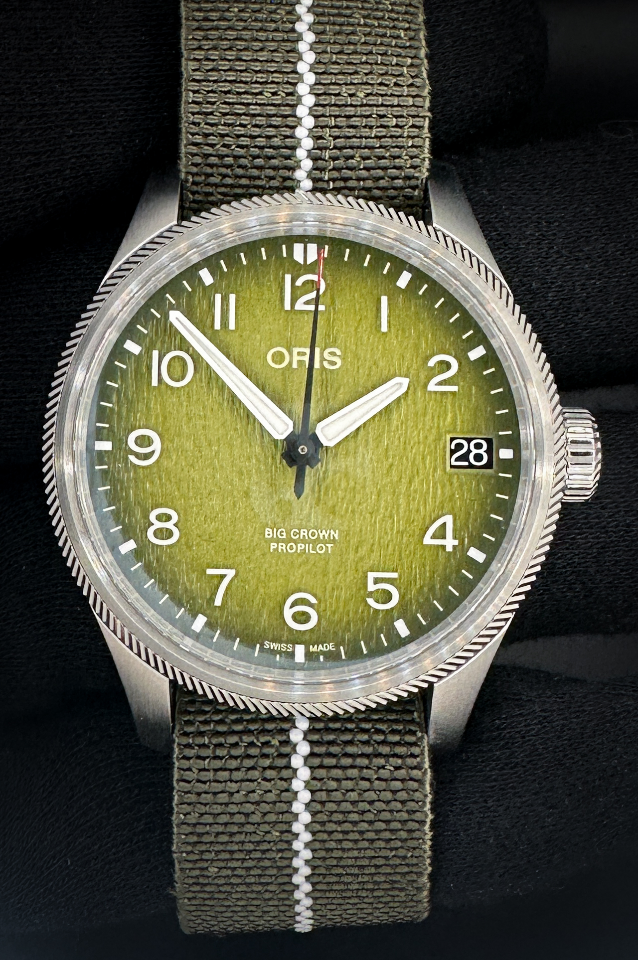 New Unworn, 41mm Oris ProPilot Okavango Air Rescue Limited Edition #135/2011. Includes the original outer box, inner case, folder, instruction booklet, and warranty card. The Oris ProPilot Okavango Air Rescue Limited Edition is a purpose-built pilot’s instrument created in partnership with Okavango Air Rescue, the aeromedical helicopter service operating in Botswana’s Okavango Delta. This exceptional model features a bold 44mm stainless steel case paired with a rich green dial inspired by the lush landscape of the Okavango region. High-contrast luminous Arabic numerals, an oversized pilot’s crown, and a robust multi-piece case construction ensure maximum legibility and durability in demanding environments. Powering the watch is the Oris Calibre 751 Swiss automatic movement, delivering reliable performance and a 38-hour power reserve.