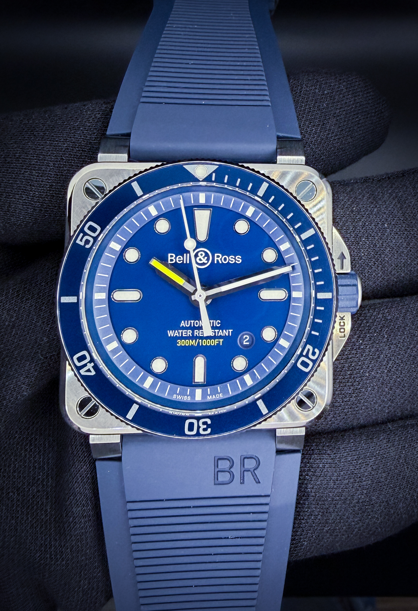 Bell and Ross BR0392-D-BU-ST-SR in a 42mm stainless steel case, powered by the BR-Cal. 302 automatic movement. This Bell and Ross is in excellent condition and includes: Outer Box; Inner Case; International Warranty Book and User Guide; Two Bracelet Tools; Extra Strap Keeper; New Nylon Extra Strap; and an unactivated Jomashop Warranty Card.