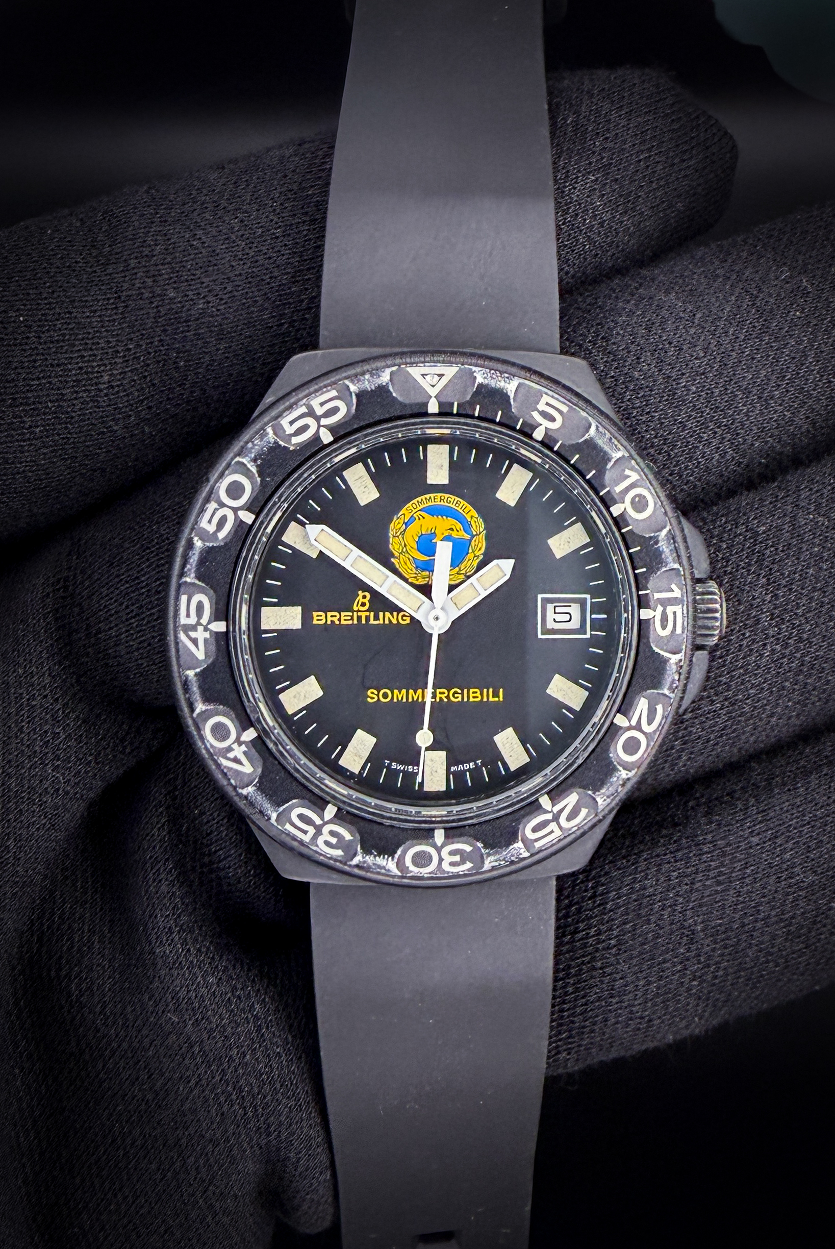 c. 1980's Breitling Colt Military 80210 "Sommergibili" (Submariner), in a 38mm black PVD coated case, powered by the Breitling-hallmarked ETA 965.312 quart movement. This Colt is in wonderful working order with a new battery installed Jan 2026.  The crystal is clear with no scratches or edge-chips. The original dial and hands are beautiful, with a light patina to the original lume. The bezel shows edge-wear consistent with age and use, but the numerals are crisp and clean. The bezel *clicks* and rotates smoothly. Overall the case is in wonderful condition, with no significant scratches, mars, or dents. 