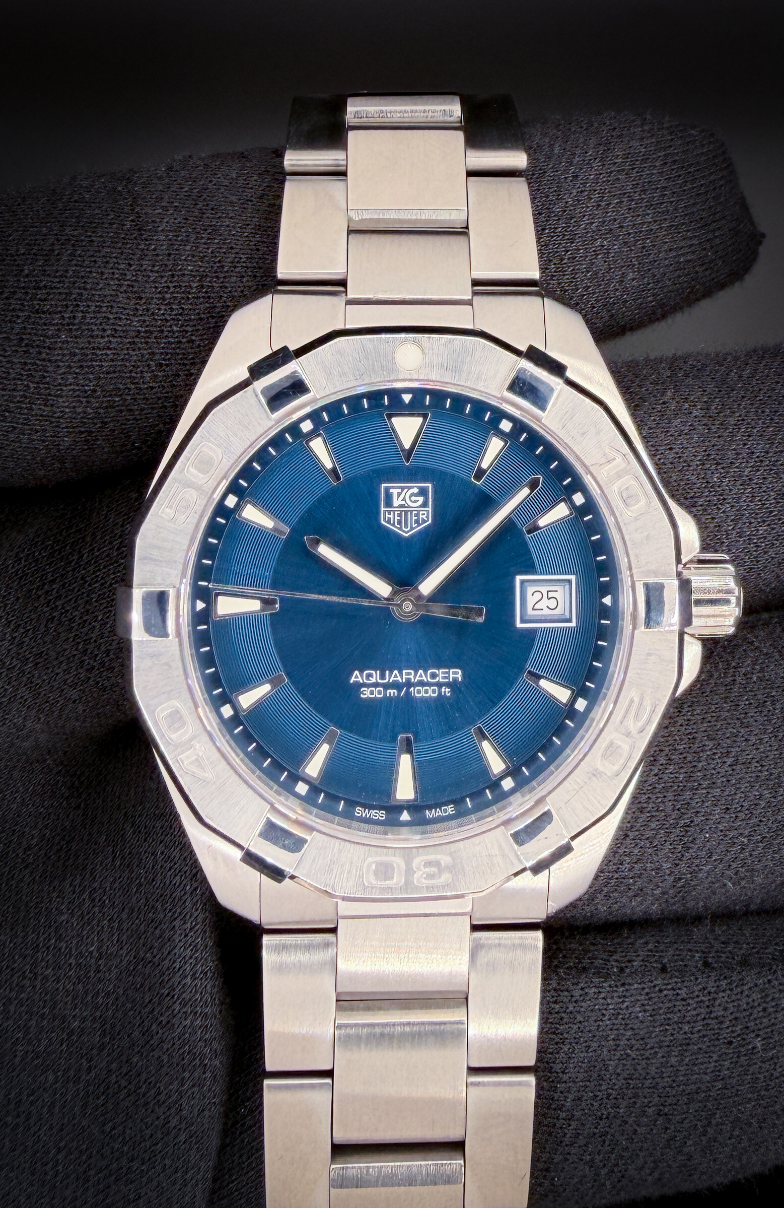 Tag Heuer Aquaracer WAY1112.BA0928 in a 42mm stainless steel case. This Tag Heuer has a new battery installed February 2026 and includes: Outer Box, inner case; instruction booklet; and warranty card. This Tag Heuer is paired with the original stainless steel bracelet and has six (6) full and one (1) half-link currently installed. The bracelet will fit up to an 8.5 inch wrist.