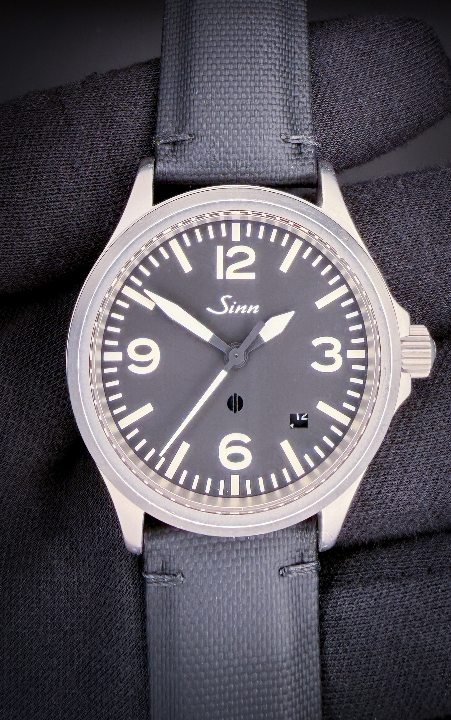 Sinn 656.1019 Fliegeruhr Pilot Cockpit in a 39mm stainless steel case, featuring the ETA 2824-2 automatic movement. This Sinn has been tested in excellent working order and is ready for wear or to add to a collection. Includes a new Wrist Wraith travel case. The crystal is clear and free of scratches or mars. The original dial and hands are beautiful, with no marks or discoloration. Overall the case is in excellent condition, with a few light lines consistent with careful use. This Sinn is paired with a new, unworn, black sailcloth strap with a stainless steel buckle. 