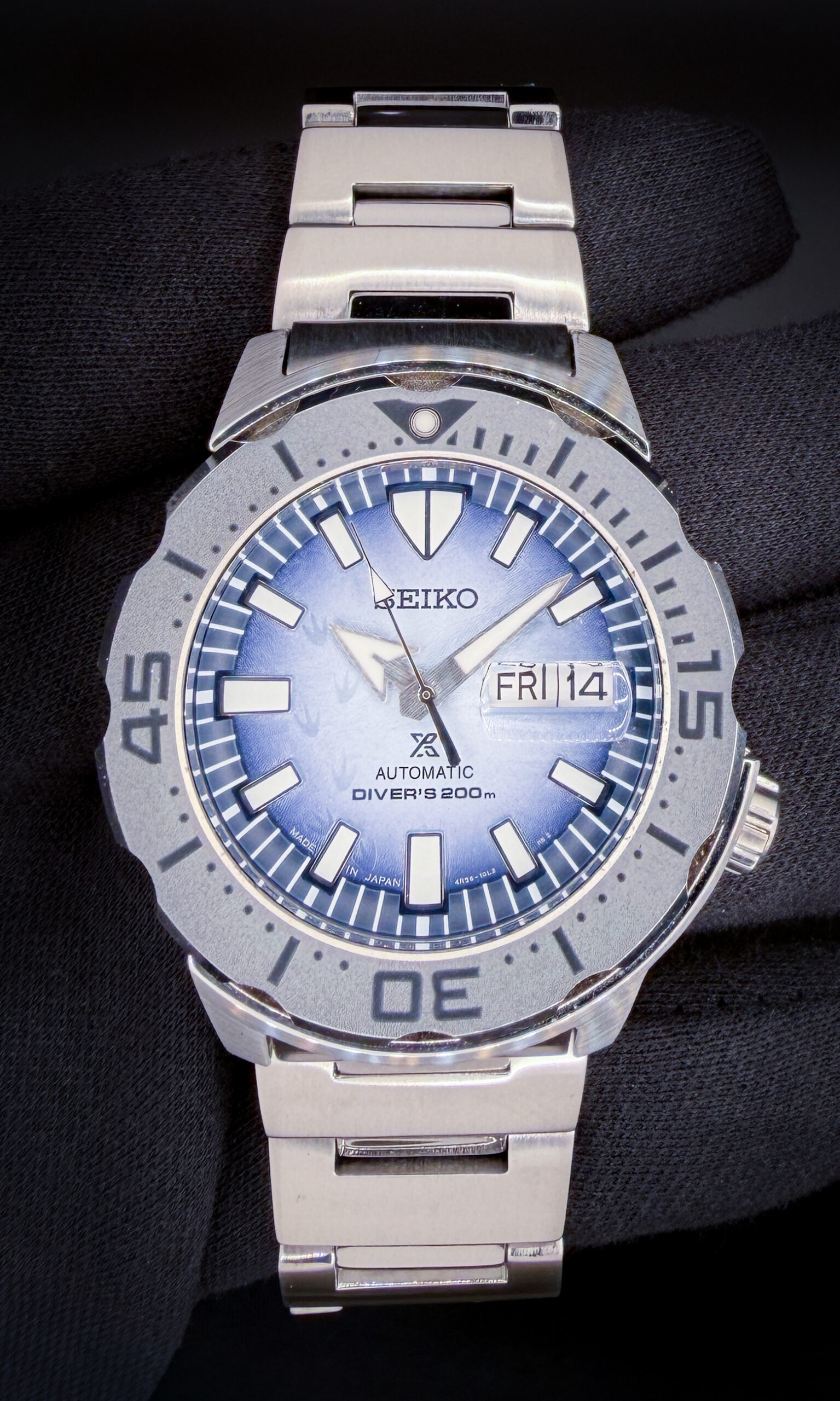 Seiko Save the Ocean Prospex Monster "Penguin Feet" SRPG57 in a 42mm stainless steel case, powered by the Seiko 4R36 automatic movement. This Seiko has been tested in excellent working order and is ready for wear or to be added to a collection. Includes the original Seiko hang-tag and a Crown & Caliber travel case. This Seiko is paired with the original, unworn, full-linked bracelet with the protective plastic still applied.