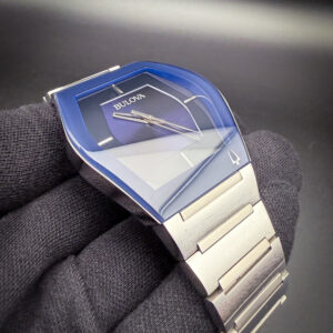 Bulova Gemini Futuro 96A258 in a 40mm curved case, powered by the Bulova GL34-10A quartz movement. This Bulova has been tested in excellent working order and is ready to wear. Includes the instruction pamphlet with open warranty card. This Bulova is paired with the original integrated stainless steel bracelet. The bracelet has three (3) full and one (1) half-link currently installed. Four (4) additional full-links are supplied with the watch. The bracelet will currently fit a 7.5 inch wrist and up to an 8.5 inch wrist with the extra links installed.