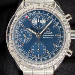 Offered here is the vintage Omega Speedmaster Day-Date Triple Calendar 3523.80.00 in a 39mm stainless steel case, featuring the Omega caliber 1151 automatic movement. Includes the Omega white cardboard box; Wood Case; Omega Travel Box; and TLC Warranty/Authentication card. Caseback Serial Number: 57306XXX