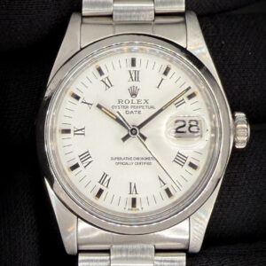 Vintage 1975 Rolex Oyster Perpetual Date reference 1500, featuring a crisp white dial with Roman numerals, painted minute track, and classic acrylic crystal with Cyclops date magnification. The stainless steel case measures approximately 34mm, delivering the timeless proportions that define vintage Date references. The smooth polished bezel frames the dial cleanly, giving this watch a refined and understated vintage presence. Case Serial Number: 3968XXX This example was serviced in February 2026 and is running exceptionally well. Accuracy Testing: +2 seconds per day / 295 amplitude / 0.1ms beat error