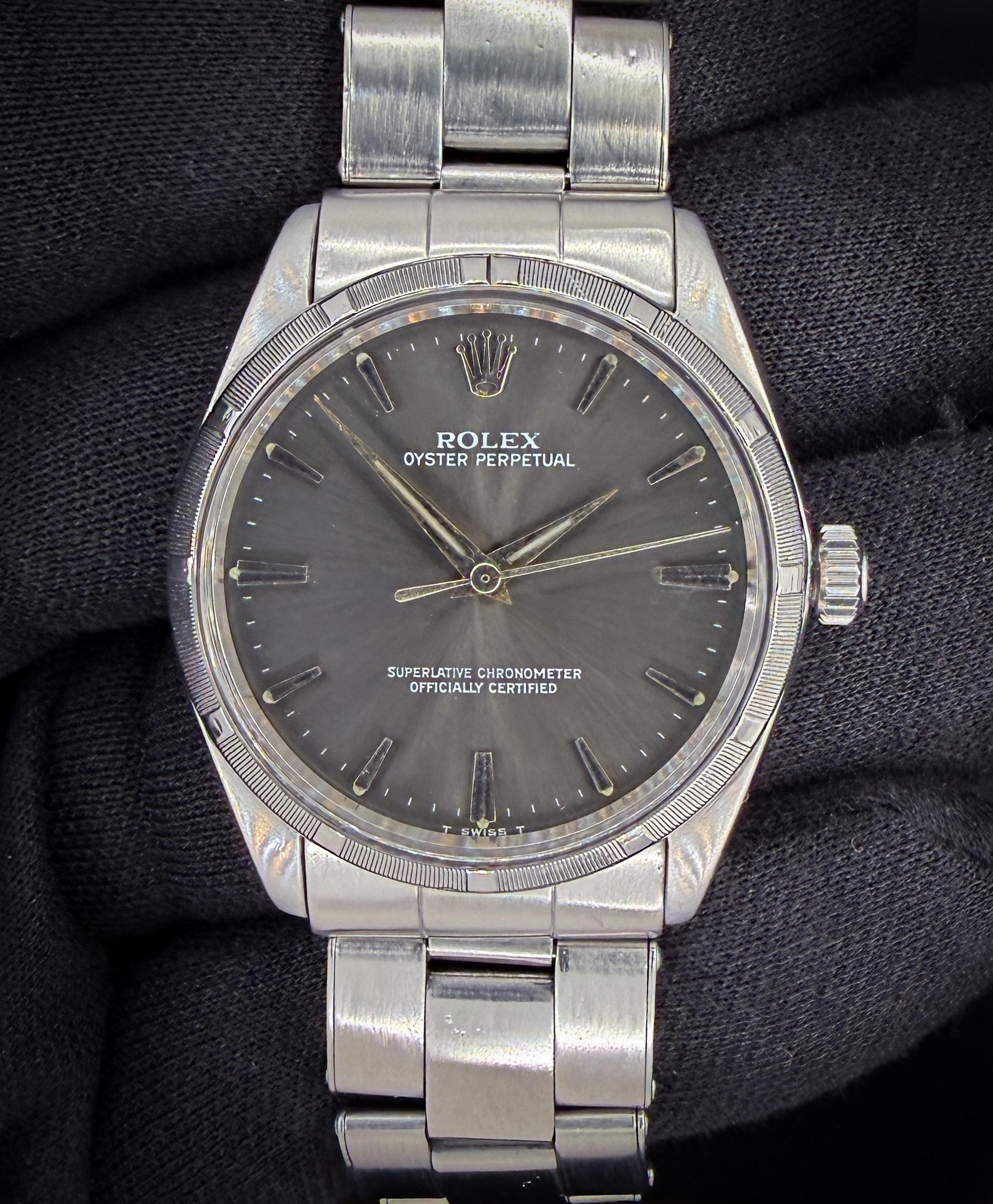 Offered here is the Rolex Oyster Perpetual reference 1007, a classic vintage example from 1963 showcasing the understated design that defines early Oyster Perpetual models. This example features an original grey dial with simple baton hour markers and a clean, no-date layout, giving it a balanced and timeless appearance that remains highly versatile for daily wear or collection. Case Serial Number: 968XXX Accuracy: +7 SPD / 260 amplitude / 0.1ms beat error