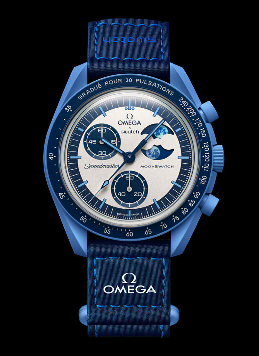 Celebrating the summer season and the blue moon of August 19, 2024 this chronograph features a blue Bioceramic case, crown and pushers as well as a blue VELCRO® strap with contrasting light blue topstitching and a blue Bioceramic attachment loop. It has a blue and silver-opaline panda dial with blue hands and hour markers. Unlike the other models in the Bioceramic MoonSwatch Collection, the blue Bioceramic bezel features a pulsometer scale with white markers. This model stands out with its moon phase function, arguably the most poetic of all watch complications. Two oversized blue moons rest against a dark blue moon phase disc, which rotates in the subdial set at 2 o’clock. Under UV light, a secret detail appears on the moon phase mask and disc. A moon with various shades of blue can be seen on the battery cover. All dials in the collection carry the OMEGA X Swatch branding, the iconic Speedmaster logo and the MoonSwatch logo. The box-shaped biosourced glass construction, the etched "S" in the center of the glass referencing the Swatch logo, the fine and sophisticated circular pattern on the dial outer ring and the recessed subdials, the sharp and smooth lugs construction and of course the unique Bioceramic feel are common to all models. The indexes, hour and minute hands and chronograph seconds hand sport Grade A Super-LumiNova® for a perfect glow in the dark.