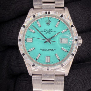 1984 Rolex Oyster Perpetual Date 15010 in a 34mm stainless steel case, powered by the Rolex 3035 automatic movement. This watch is paired with a new customized Tiffany-Blue dial. Includes the original outer box, inner case, Oyster Booklet, Instruction booklet, TLC Warranty/Authentication card, as well as the original Rolex silver stick dial. Case Serial Number: 8180XXX