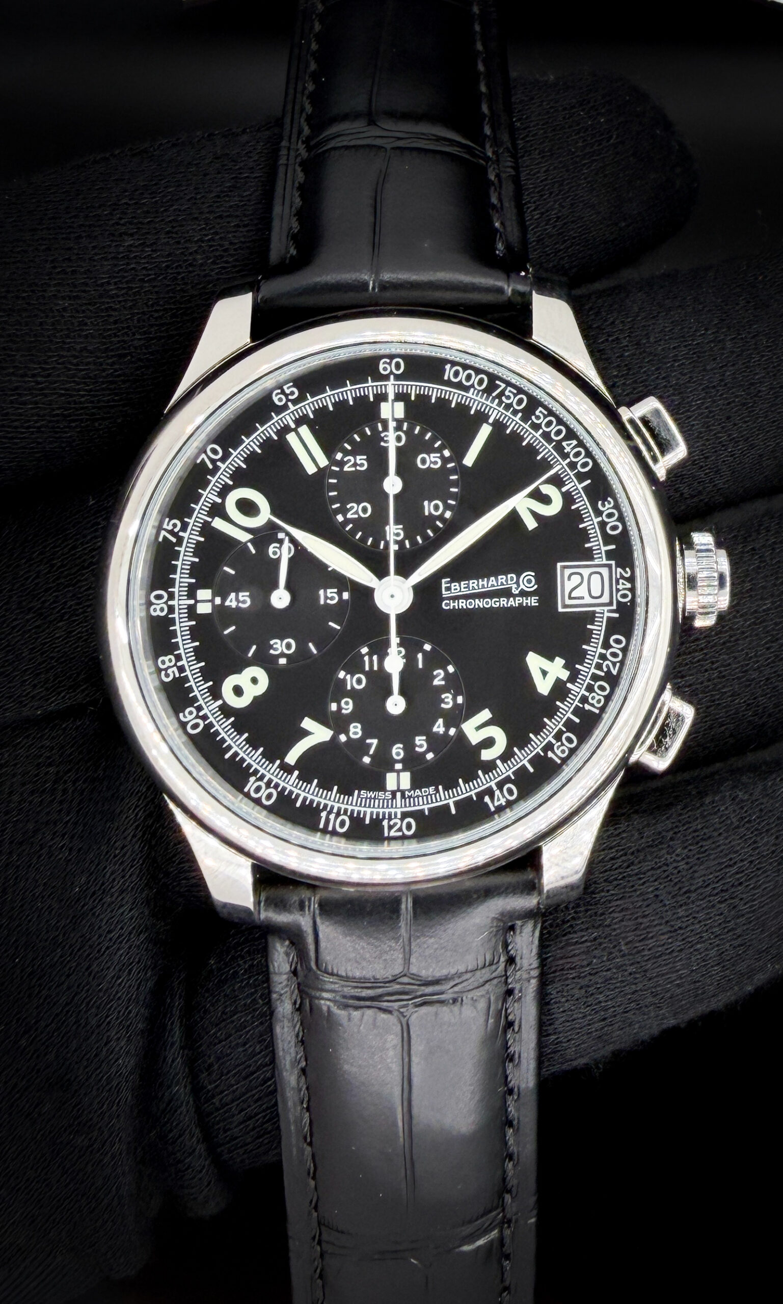 New Eberhard &  Co. Traversetolo Chronograph 3105.1 in a 43mm stainless steel case, featuring the ETA A07.211 automatic movement. This Eberhard includes: Outer Box, Leather Case, Eberhard Stainless Steel Bracelet, and Guarantee booklet with cards. The black leather strap is new, aftermarket, and will fit a 8.25 inch wrist. The new and original metal bracelet two (2) full and two (2) half-links currently installed and will fit an 7-inch wrist