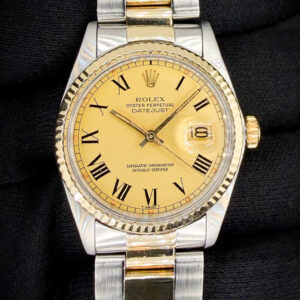 1979 Rolex Oyster Perpetual Date 16013 in a 36mm stainless steel and yellow gold case, featuring the stunning matte-gold roman numeral dial, and powered by the Rolex caliber 3035 automatic movement. This Rolex has been tested in excellent working order and is ready to wear or to be added to a collection. Includes the original outer box and inner case. Case Serial Number: 5824XXX