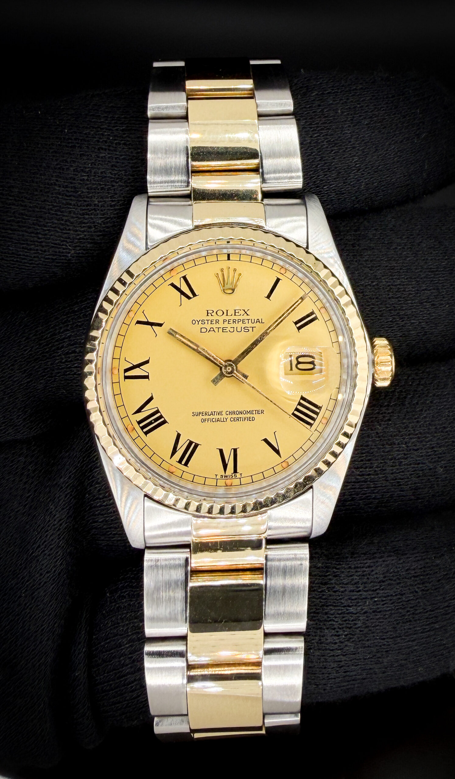 1979 Rolex Oyster Perpetual Date 16013 in a 36mm stainless steel and yellow gold case, featuring the stunning matte-gold roman numeral dial, and powered by the Rolex caliber 3035 automatic movement. This Rolex has been tested in excellent working order and is ready to wear or to be added to a collection. Includes the original outer box and inner case. Case Serial Number: 5824XXX