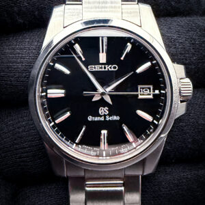 2012 Grand Seiko Heritage Collection SBGX055 in a 37mm stainless steel case, powered by the Grand Seiko 9F62 quartz movement. This GS has been tested in excellent working order with a new battery installed April 2026. Includes: Case, warranty cover; instruction booklet and extra links.