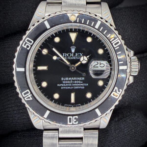 1986 Rolex Submariner Date 16800 featuring a beautiful tropical dial, in a 40mm stainless steel case, powered by the Rolex 3035 automatic movement. This Submariner has been texted in excellent working order and is ready for daily wear or to be added to a collection. Case Serial Number: 9311XXX
