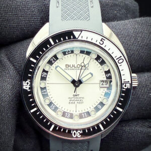 Bulova Oceanographer GMT 98B407 Full-Lume Dial in a 41mm IP coated stainless steel case, power by the Miyota 9075 automatic movement. This watch has been tested in excellent working order and is ready for wear or to be added to a collection. This Bulova includes the outer sleeve; case, tag, and open warranty booklet.  The crystal is clear and free of scratches or edge-chips. The bezel is clean with no scratches. The dial and hands are pristine with no stains or discoloration. The case is wonderful with a few light lines from careful use.