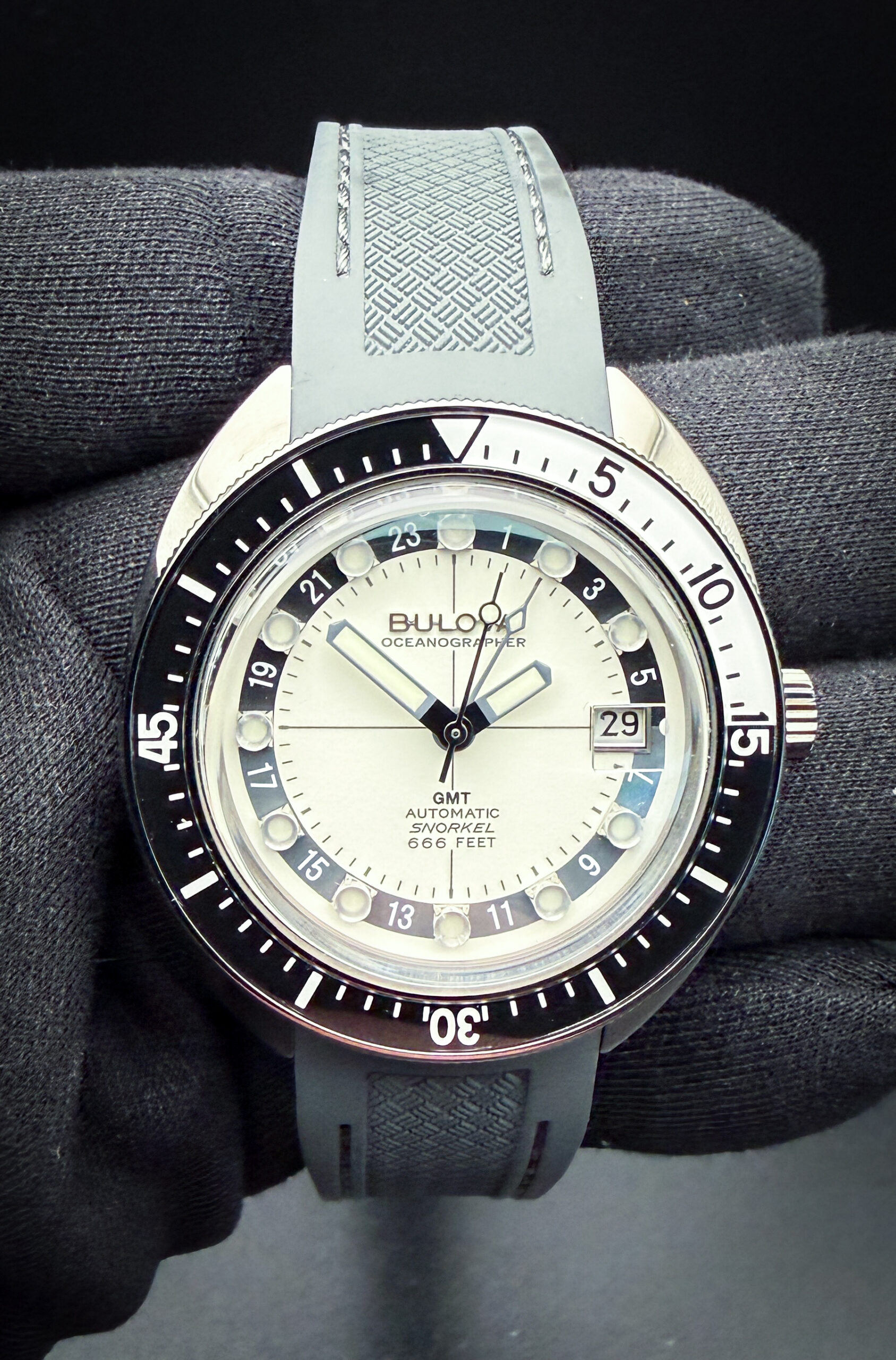 Bulova Oceanographer GMT 98B407 Full-Lume Dial in a 41mm IP coated stainless steel case, power by the Miyota 9075 automatic movement. This watch has been tested in excellent working order and is ready for wear or to be added to a collection. This Bulova includes the outer sleeve; case, tag, and open warranty booklet.  The crystal is clear and free of scratches or edge-chips. The bezel is clean with no scratches. The dial and hands are pristine with no stains or discoloration. The case is wonderful with a few light lines from careful use.