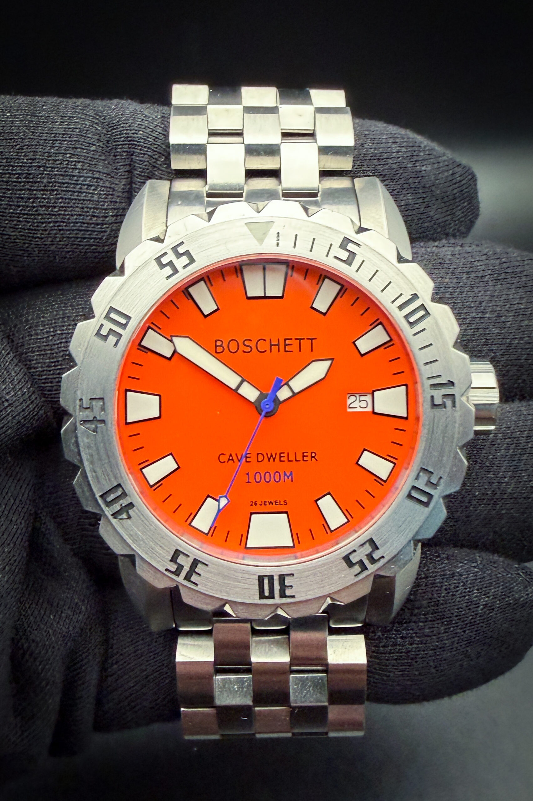 Boschett Cave Dweller B03.4.0829 in a 44mm stainless steel case, powered by the Sellita SW-200 automatic movement. This watch has been tested in excellent working order and is ready to wear and to be added to a collection. Includes: Leather Case; Hang Tag; Instruction USB Drive-Card; new unworn rubber strap; hang-tag; extra links; and Warranty Card dated 2-19-24. The crystal is clear and free of scratches or mars. The dial and hands are pristine with no stains or discoloration. The case is wonderful, with a few light spider-lines from careful use.  This Boschett is paired with the original stainless steel bracelet with micro-adjusment buckle. The bracelet has two full links currently installed and will fit a 7.25 inch wrist. Five (5) extra links are included in the box to add an additional 1.5 inches. 