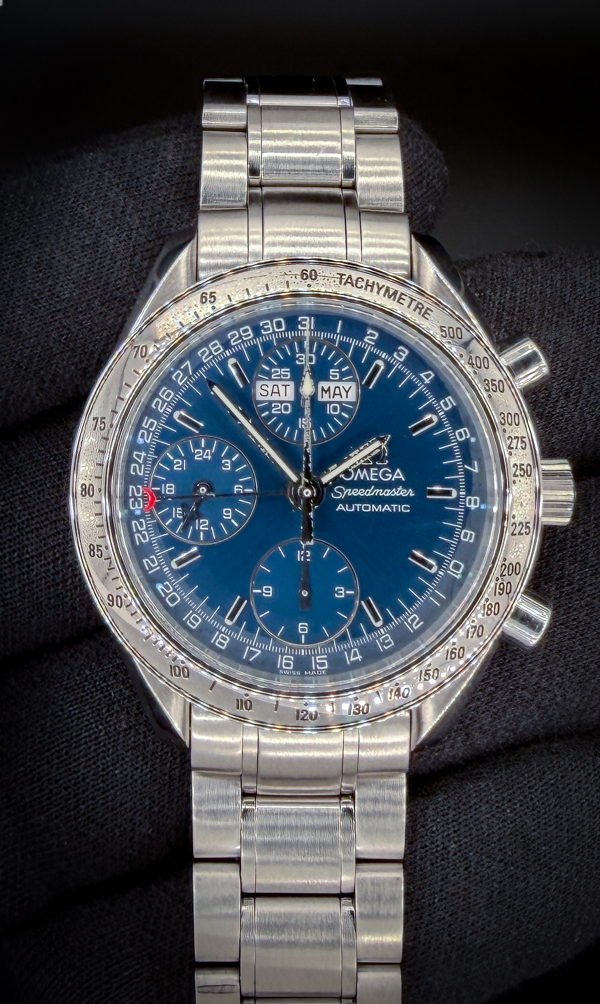 Offered here is the vintage Omega Speedmaster Day-Date Triple Calendar 3523.80.00 in a 39mm stainless steel case, featuring the Omega caliber 1151 automatic movement. This Speedmater has been tested in good working order, with all functions operating as designed. Includes the Omega white cardboard box; Wood Case; Omega Travel Box; and TLC Warranty/Authentication card. Caseback Serial Number: 57790655