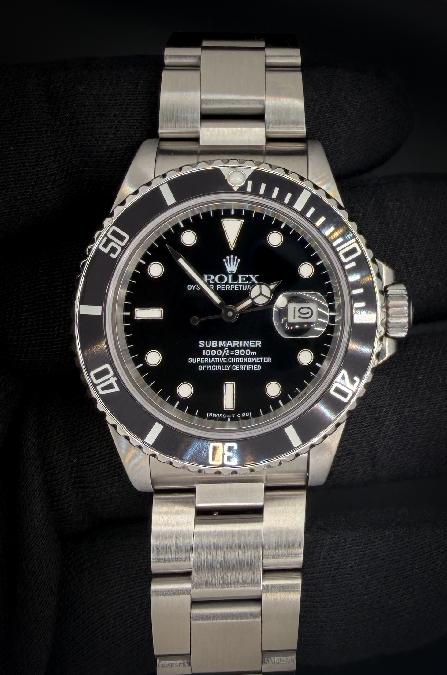 1988 Rolex Submariner Date 168000 "Triple 0" "Ghost Reference" in a 40mm stainless steel case, featuring the Rolex calibre 3035 automatic movement. This Rolex  has been tested in excellent working order. A new bezel insert has been installed and the original insert is included for provenance.  Accuracy Testing: +4 SPD / 265 Amplitude / .0ms Beat Error Case Serial Number: R383677