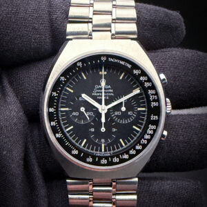 Stunning 1969 Omega Speedmaster 145.014 in a stunning steel tonneau case, powered by the legendary Omega Cal. 861 hand-wound movement. This Speedmaster was fully serviced and restored by experts at TM Watch Co. in June 2026. Serial Number: 31320XXX This watch includes the Omega red service container and the TM Watch Co. Service Documents.