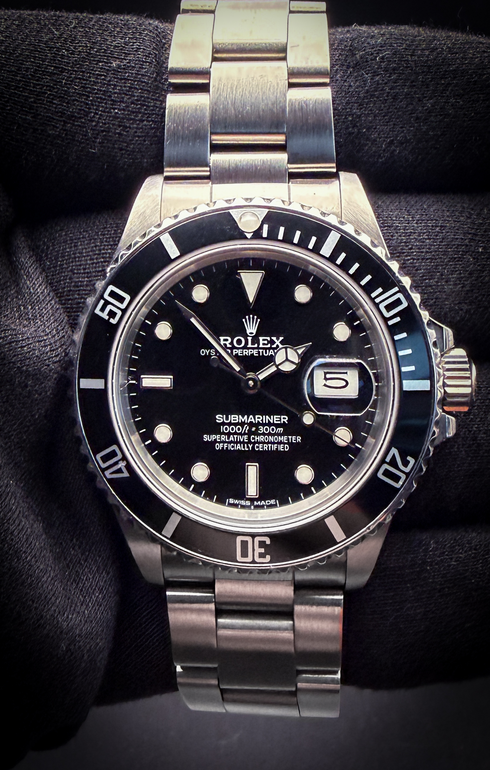 1987 Rolex Submariner Date 168000 "Triple-Zero" "Ghost Reference"  in a 40mm stainless steel case, featuring the Rolex calibre 3035 automatic movement. This Rolex includes recent service documentation from Rolex Japan and a new Wrist Wraith Travel Roll.  Accuracy Testing: + SPD / 271 Amplitude / .1ms Beat Error Case Serial Number: R590XXX