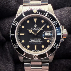 1988 Rolex Submariner Date 16610 featuring an original feet-first tropical spider dial. This Submariner is powered by the Rolex 3135 automatic movement. Includes a new Wrist Wraith travel roll and TLC Warranty/Authentication card.  Case Serial Number: R984XXX