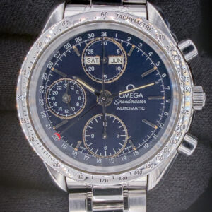 Omega Speedmaster Triple Calendar Day-Date 3521.80.00, c. 1998, in a 39mm stainless steel case, powered by the Omega 1150 automatic movement. Includes: white Omega outer box; inner wooden case; instruction book; travel case; leatherette wallet, and TLC Warranty/Authentication card.  Accuracy Testing: +4 SPD / 271 Amplitude / .1ms Beat Error Case Serial Number: 54872XXX