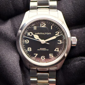 Hamilton Khaki Field "Murph" 38mm H704050 in a 38mm stainless steel case, powered by the ETA CO7611+ automatic movement. This Hamilton is in excellent condition and ready to wear. Includes: Outer Box; Inner Case; Instruction Book; Tan Nylon two-piece strap; and Open Warranty Card.